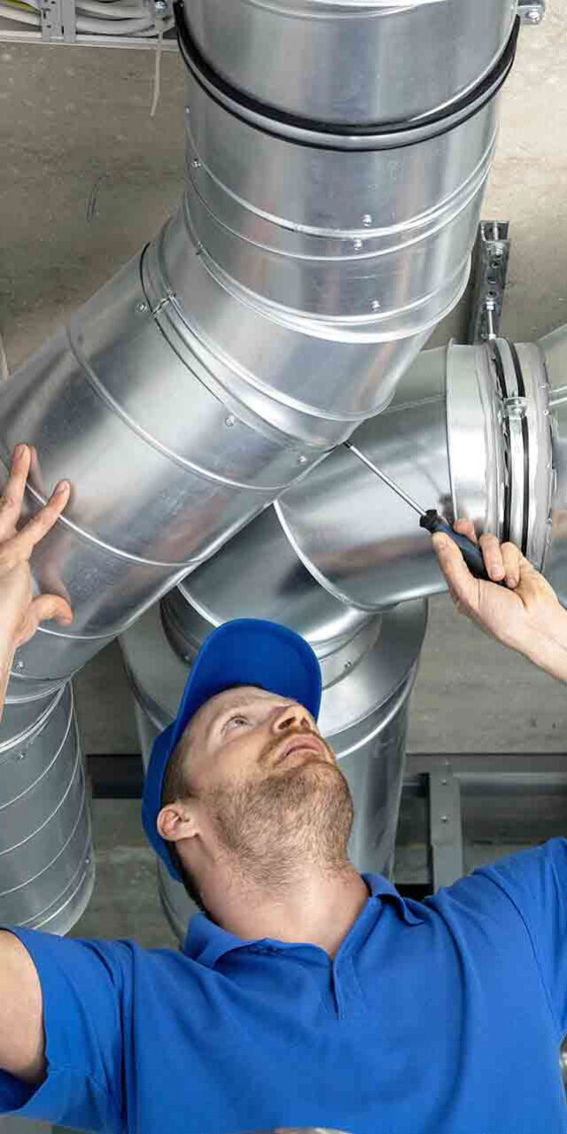 man fixing cooling & heating system
